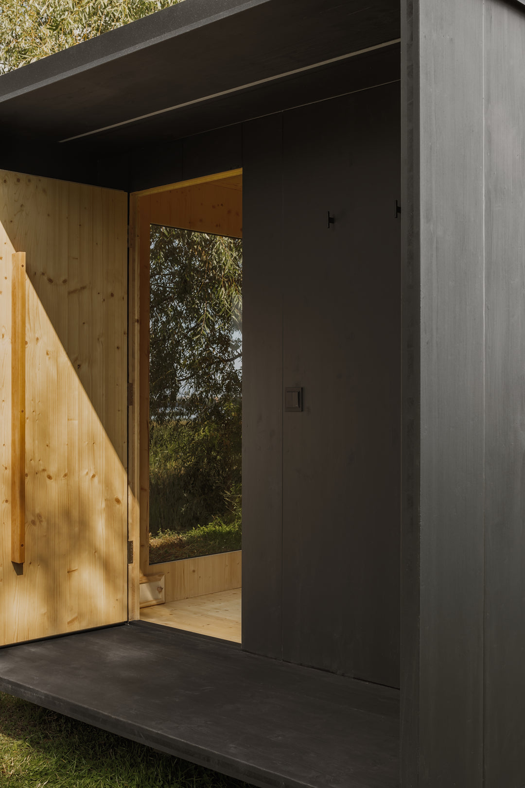 DEIZ outdoor CLT sauna architectural detail with panoramic glazing